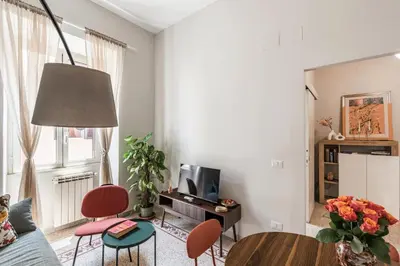 a living room with a couch and a table at Maggiore Home in Rome
