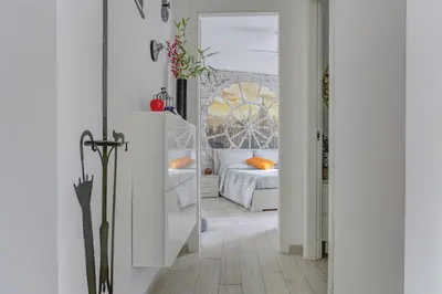 a hallway with a bedroom with a bed at Delizioso attico con terrazzo in Rome