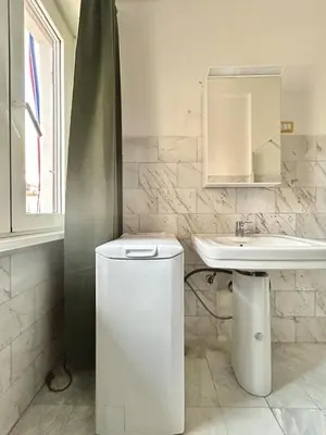 a bathroom with a toilet and a sink at Cipro Vatican Home in Rome