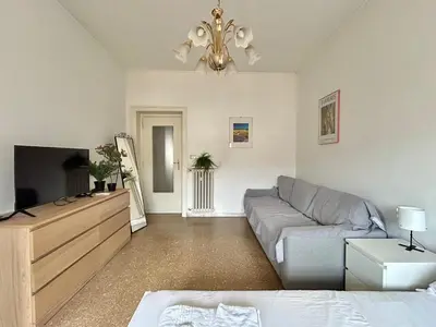 a living room with a couch and a tv at Cipro Vatican Home in Rome