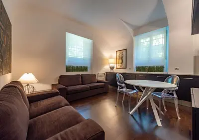 a living room with a couch and a table at Domus Aventino Apartment in Rome