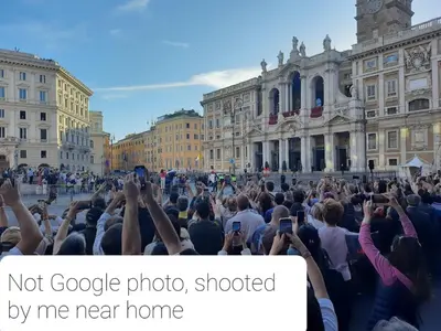 a crowd of people holding up their hands in the street at Artist's House Colosseum in Rome