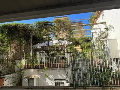 a building with plants on the side of it at La Casetta Monteverde in Rome
