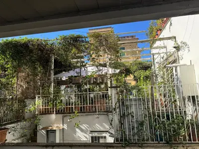 a building with plants on the side of it at La Casetta Monteverde in Rome