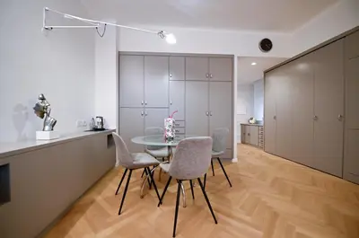a kitchen and dining room with a table and chairs at Dolce Vita Suite by Rental in Rome in Rome