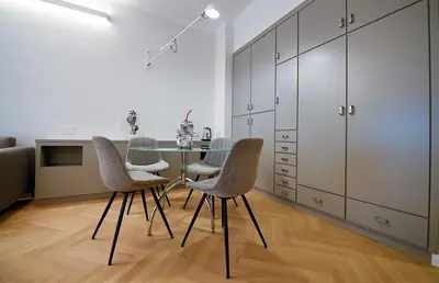 a dining room with a table and four chairs at Dolce Vita Suite by Rental in Rome in Rome