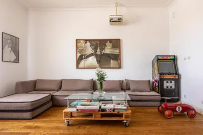 a living room with a couch and a video game at Casa Lea by Hili in Rome