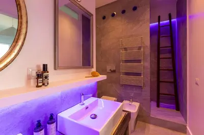 a bathroom with a sink and a toilet and a mirror at Casa Lea by Hili in Rome