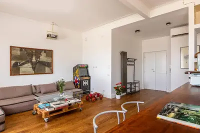 a living room with a couch and a video game at Casa Lea by Hili in Rome