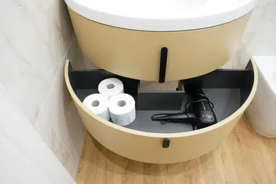 a bathroom with a sink and two rolls of toilet paper at Barocci Home in Rome