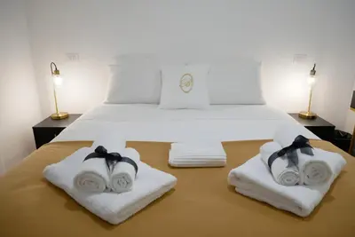 a bedroom with a bed with towels on it at Barocci Home in Rome