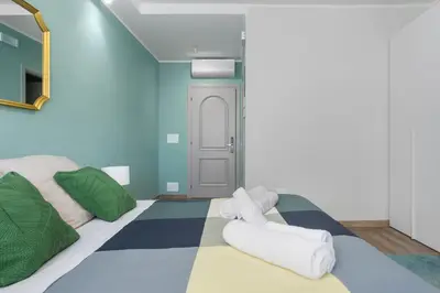 a room with a bed with towels on it at Conca D'Oro Guest House - Elisabetta in Rome