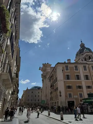a group of people walking down a city street at Independent house- Heart of Rome in Rome