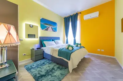 a bedroom with a large bed and a window at Eternal Residency Roman Escape in Rome