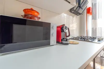 a microwave oven sitting on a counter in a kitchen at Eternal Residency Roman Escape in Rome