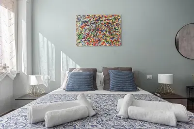 a bedroom with a bed with two pillows on it at Conca D'Oro Guest House - Anna in Rome