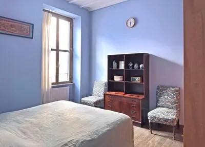 a kitchen with green and white cabinets and a sink at Monti - Colosseum - Boschetto Vintage - 2BR in Rome