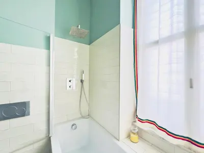 a mirror on a wall next to a door at Monti - Colosseum - Boschetto Vintage - 2BR in Rome