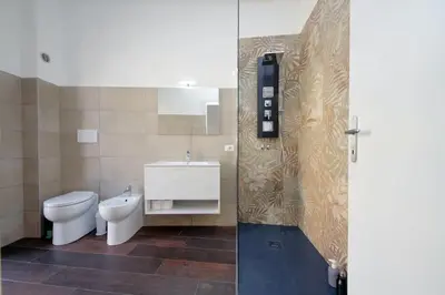 a bathroom with a toilet and a sink at Trastevere 70 in Rome
