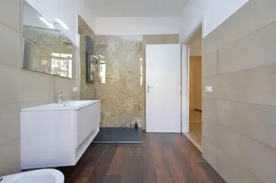 a bathroom with a white sink and a toilet at Trastevere 70 in Rome