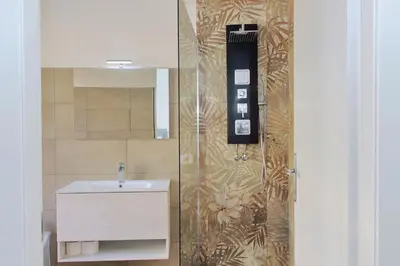 a bathroom with a sink and a mirror at Trastevere 70 in Rome