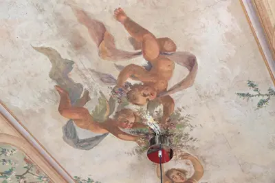 a painting of two men on a ceiling at Trastevere 70 in Rome