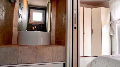 a bathroom with a sink in a room at Entire Flat at Last floor in Piazza Bologna in Rome