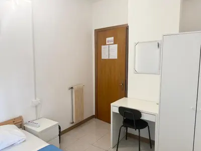 a room with a desk and a chair in it at RAHIMA GUEST HOUSe 2 in Rome
