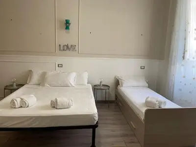 two beds sitting next to each other in a room at the room in the museum in Rome