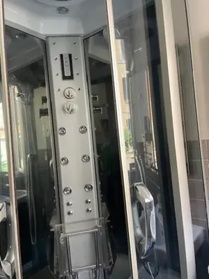 a control panel of a bathroom with a mirror at the room in the museum in Rome