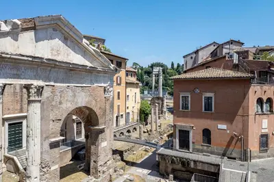 an aerial view of the ruins of an ancient city at The Best Rent - Three-Room Apartment with View of the Portico d'Ottavia in Rome
