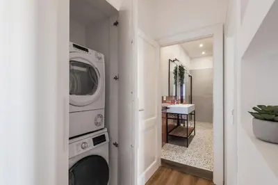 a laundry room with a washer and dryer at The Best Rent - Three-Room Apartment near Lungotevere in Rome