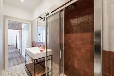 a bathroom with a sink and a shower at The Best Rent - Three-Room Apartment near Lungotevere in Rome