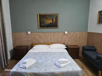 a bedroom with a bed with two towels on it at Aurora Boreale in Rome