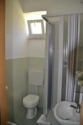 a bathroom with a toilet and a sink at Aurora Boreale in Rome