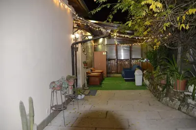 a patio with a bunch of plants and lights at Aurora Boreale in Rome