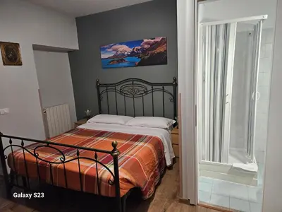 a bedroom with a bed in a room with a window at Aurora Boreale in Rome