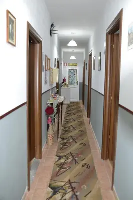 a hallway with a rug on the floor at Aurora Boreale in Rome