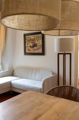 a living room with a couch and a table at Casa Vacanze Ottaviano 25 in Rome