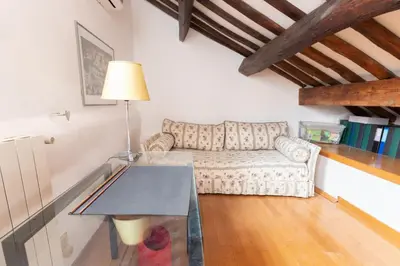 a living room with a couch and a table at 346aarome Rome Vaccarella Terrace in Rome