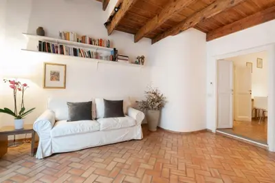 a living room with a white couch and a table at 346aarome Rome Vaccarella Terrace in Rome
