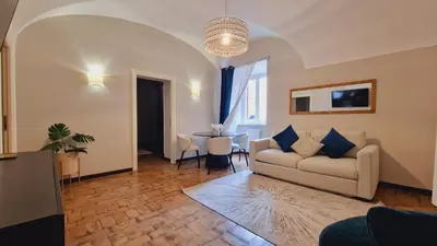 a living room with a couch and a table at Cozy Colosseum 2BR-2BA Family Home in Rome