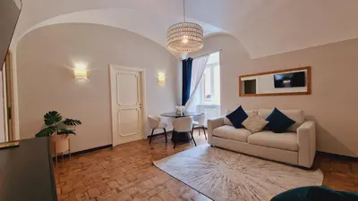 a living room with a couch and a table at Cozy Colosseum 2BR-2BA Family Home in Rome