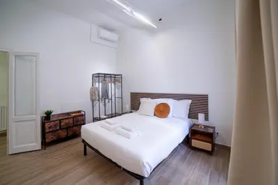 a bedroom with a large white bed with white sheets at New 3BR-2 Baths Near Vatican & Metro- The Comics House in Rome