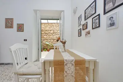 a dining room with a table and two chairs at Charming Nest Steps from the Vatican in Rome