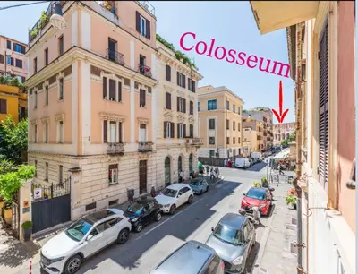 a view of a city street with cars parked at Colosseum Apartment, 3 bedrooms, 3 baths, large living room with a sofa bed, the apartment can accommodate 8 people in Rome