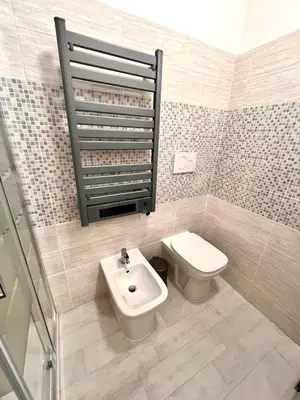 a bathroom with a toilet and a sink at Pigneto Holiday Home in Rome