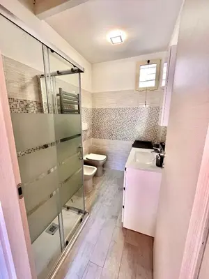 a bathroom with a shower and a toilet and a sink at Pigneto Holiday Home in Rome