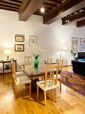 a dining room with a glass table and chairs at Very Special Place in the heart of Rome in Rome