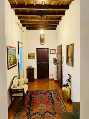a living room with a couch and a rug at Very Special Place in the heart of Rome in Rome